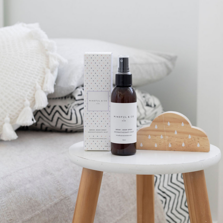 Peaceful & Co. room spray on stool